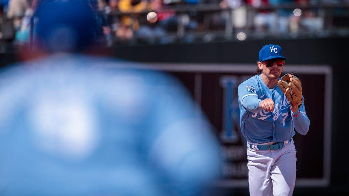 Royals shortstop Bobby Witt Jr. (7) throws to first base during the seventh inning in an April 2023 series at Kauffman Stadium in Kansas City.