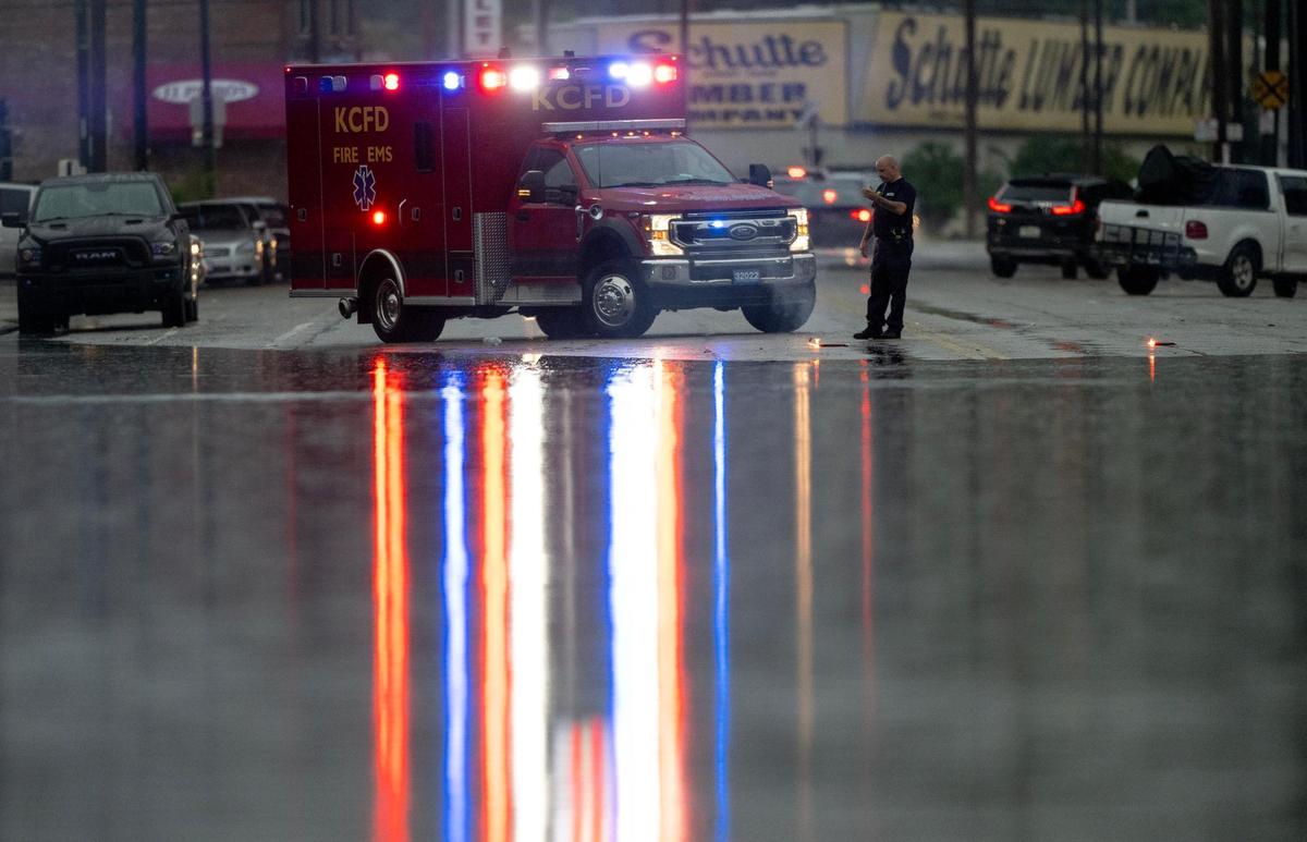 A KCFD ambulance blocks a flooded Southwest Boulevard on Friday, July 14, 2023, in Kansas City.