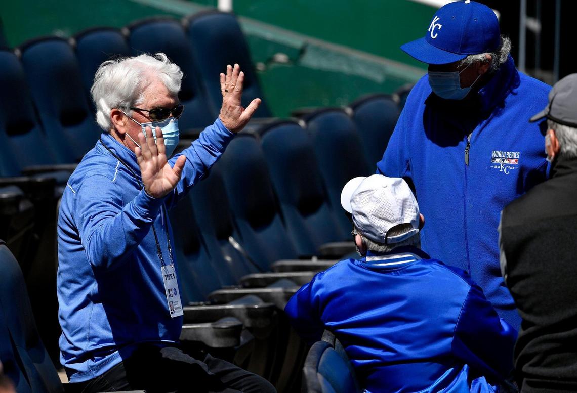 John Sherman, Chairman, CEO and principal owner of the Royals, left, watches the club work out at Kauffman Stadium before the 2021 season opener against the Texas Rangers.