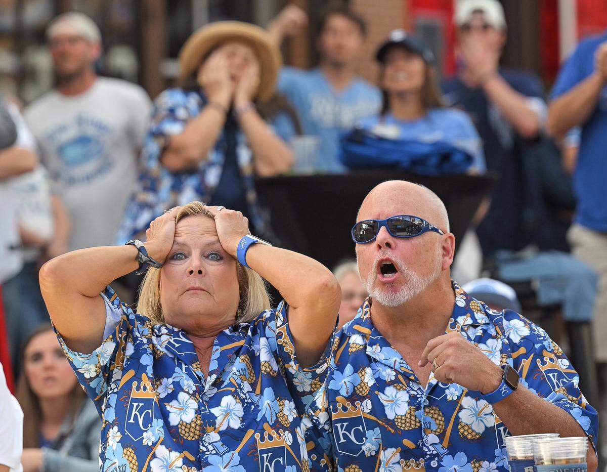 Jackie and Bob Harvey, Pleasant Hill, Missouri, react after a Royals error allowed a runner to load the bases in the 5th inning of Game 2 of the AL Wild Card game with the Baltimore Orioles. The Harveys were following the game at a watch party at KC Live! at the Power and Light District on Wednesday, Oct. 2, 2024.