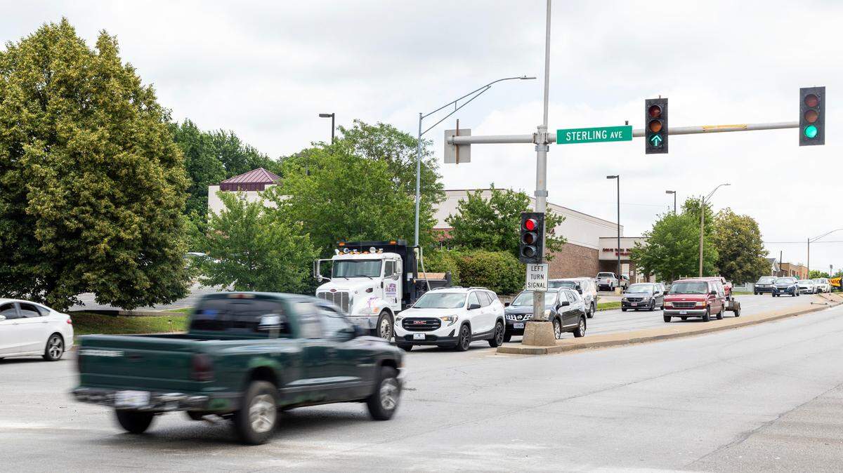 Vehicles drive through an intersection in Independence in June. Intersections can be dangerous places for drivers and pedestrians.