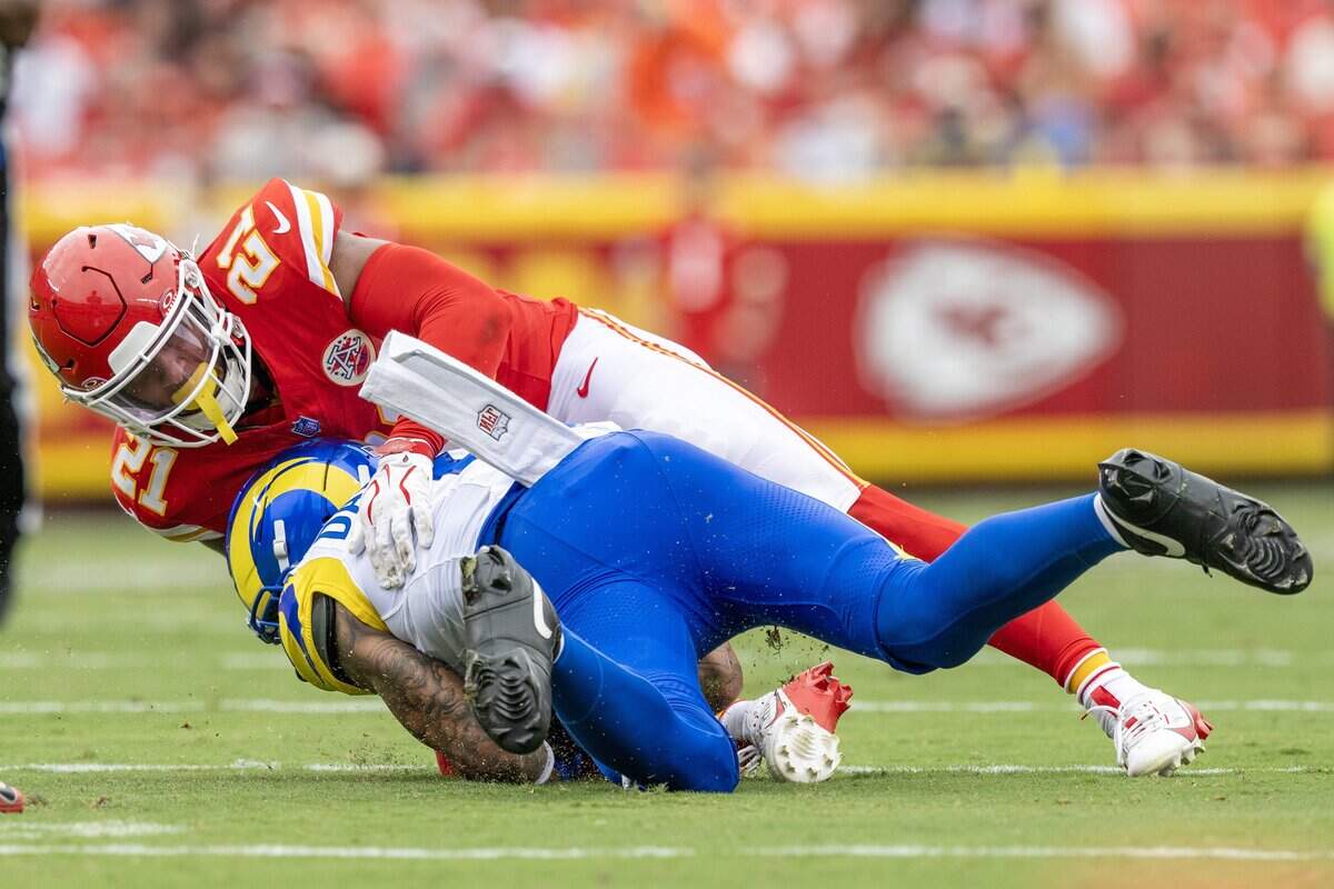 Kansas City Chiefs safety Jaden Hicks (21) tackles Los Angeles Rams wide receiver CJ Daniels (6) in the second quarter during a preseason NFL game at Arrowhead Stadium on Saturday, Aug. 15, 2026, in Kansas City.