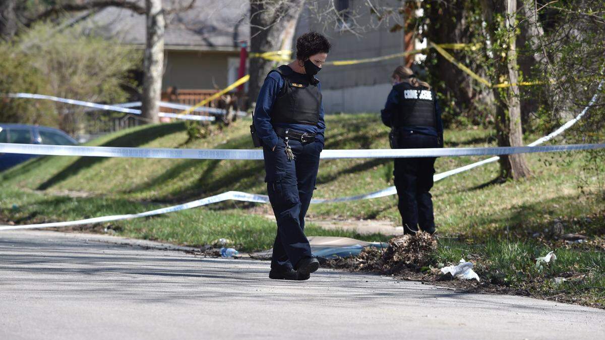 The Kansas City police investigate a double homicide at Walrond Avenue and East 67th Street on April 1.