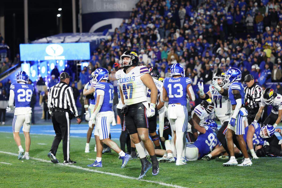Kansas Jayhawks tight end Jared Casey (47) celebrates a win over the BYU Cougars after the last play of the fourth quarter at LaVell Edwards Stadium on Nov. 16, 2024.