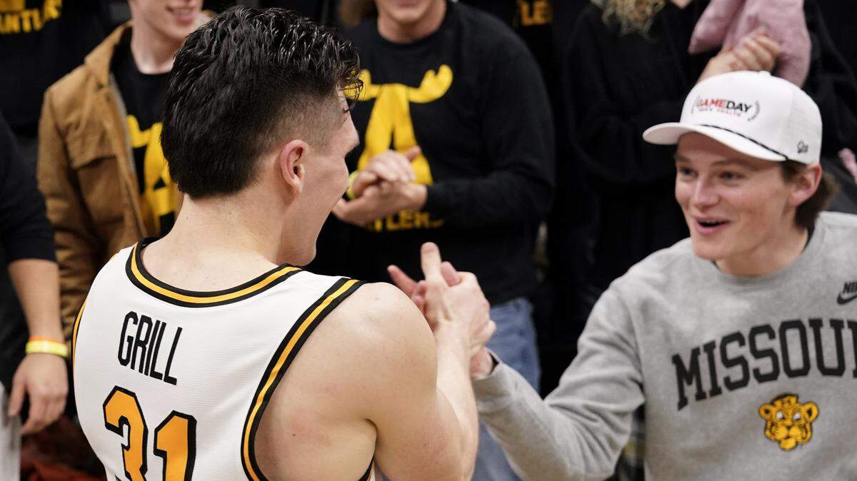 Missouri Tigers guard Caleb Grill (31) celebrates with fans after the win over the Alabama Crimson Tide at Mizzou Arena on Feb. 19, 2025.