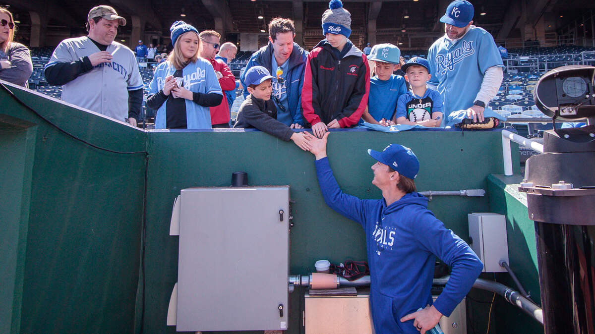 Kansas City Royals starting pitcher Brady Singer (51) meets with fans prior to the game against the Toronto Blue Jays at Kauffman Stadium.