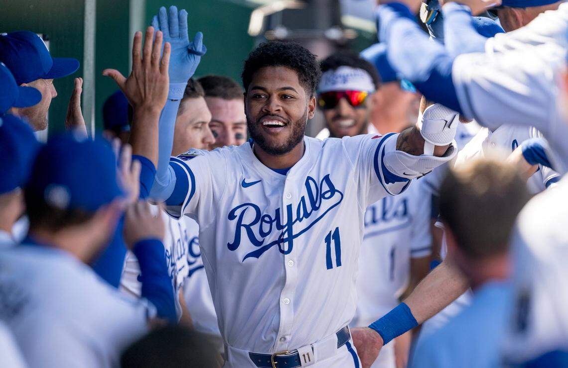 Kansas City Royals’ Maikel Garcia celebrates a home run with teammates in the dugout during the Royals’ home opener Thursday with the Minnesota Twins at Kauffman Stadium.