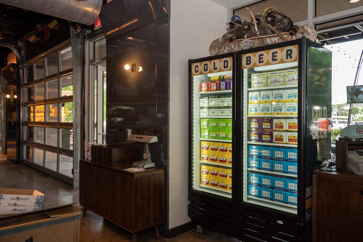 Craft beers are available to go at Big Grove Brewery's new taproom in Prairie Village, Kan., Thursday, May 14, 2026. The 12,000-square-foot facility, located in the former Macy's building at 7060 Mission Rd., is set to officially open May 21 and will feature a wide selection of the Iowa-based brewery's beers. 