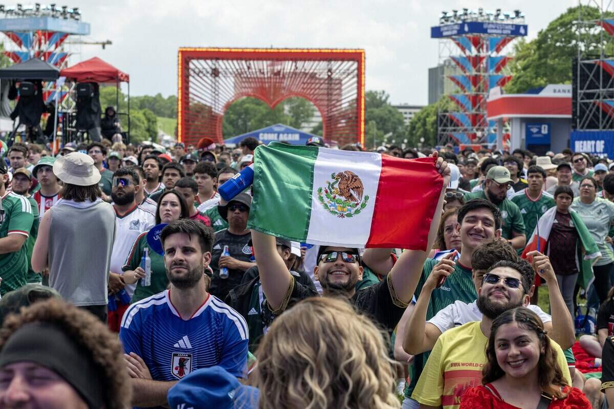 Fans cheer while watching a FIFA World Cup match between Mexico and South Africa at the FIFA Fan Festival on Thursday, June 11, 2026, in Kansas City.
