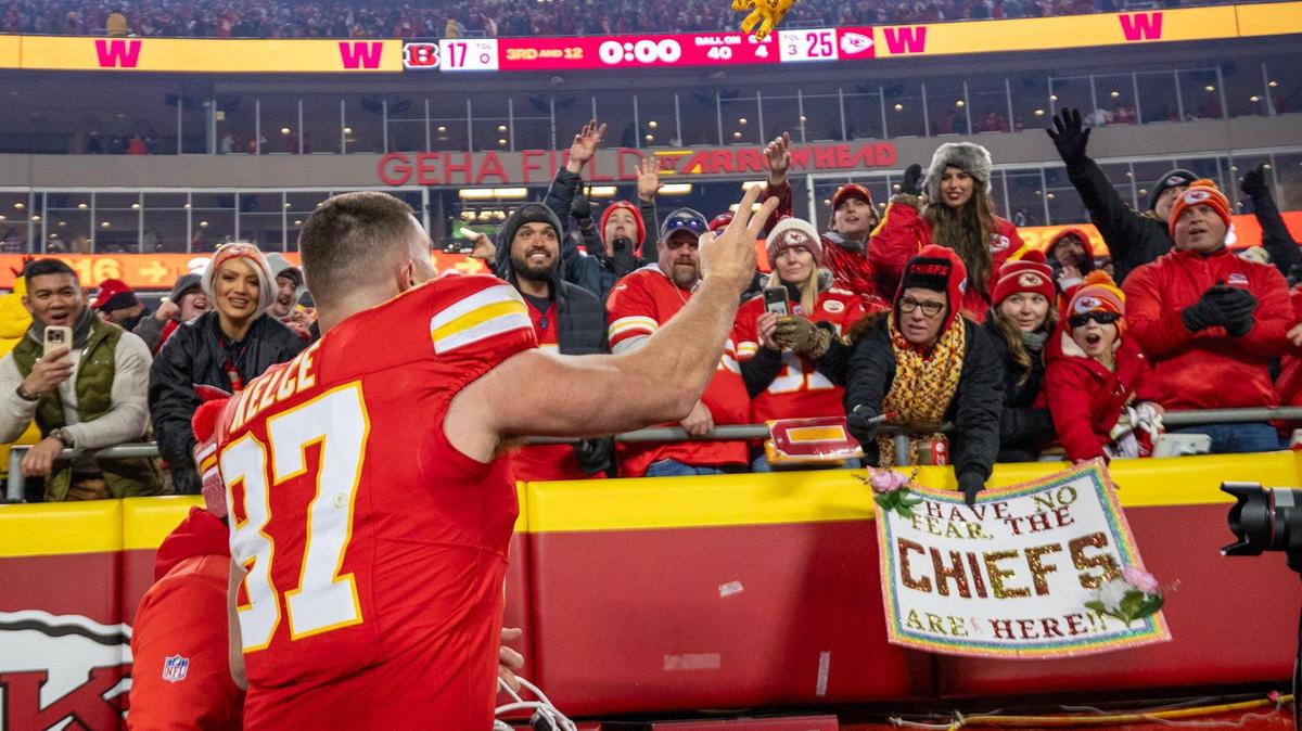 Kansas City Chiefs tight end Travis Kelce (87) tosses a glove to the fans after the Chiefs defeated the Cincinnati Bengals, 25-17, on Sunday, Dec. 31, 2023, at GEHA Field at Arrowhead Stadium.