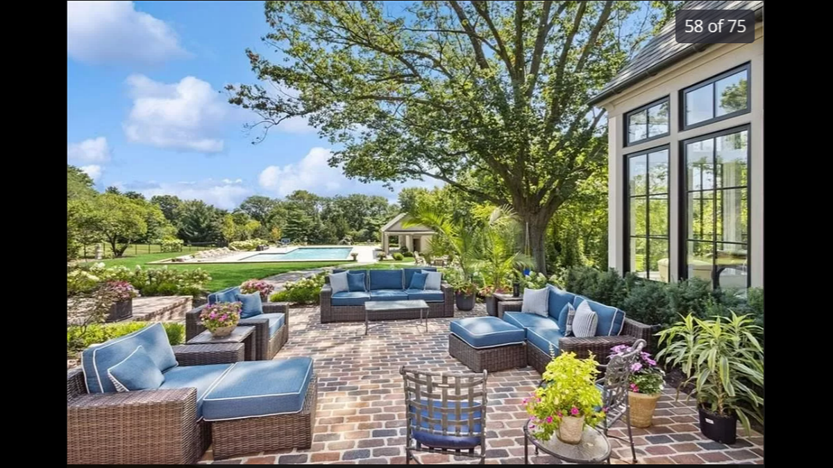 The patio at 9241 High Drive in Leawood oversees the pool.