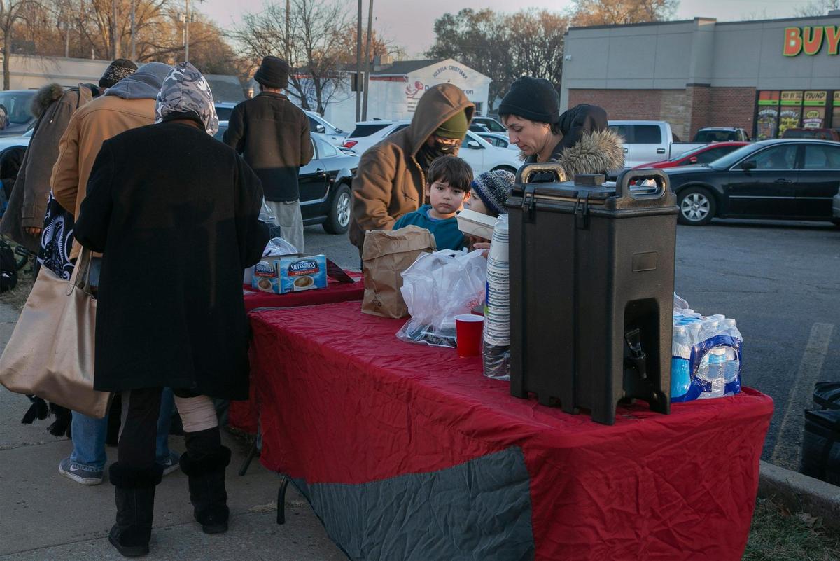 Food Not Bombs organization serving food. They serve on Sundays from 4-5 p.m. at the corner of Independence and Monroe