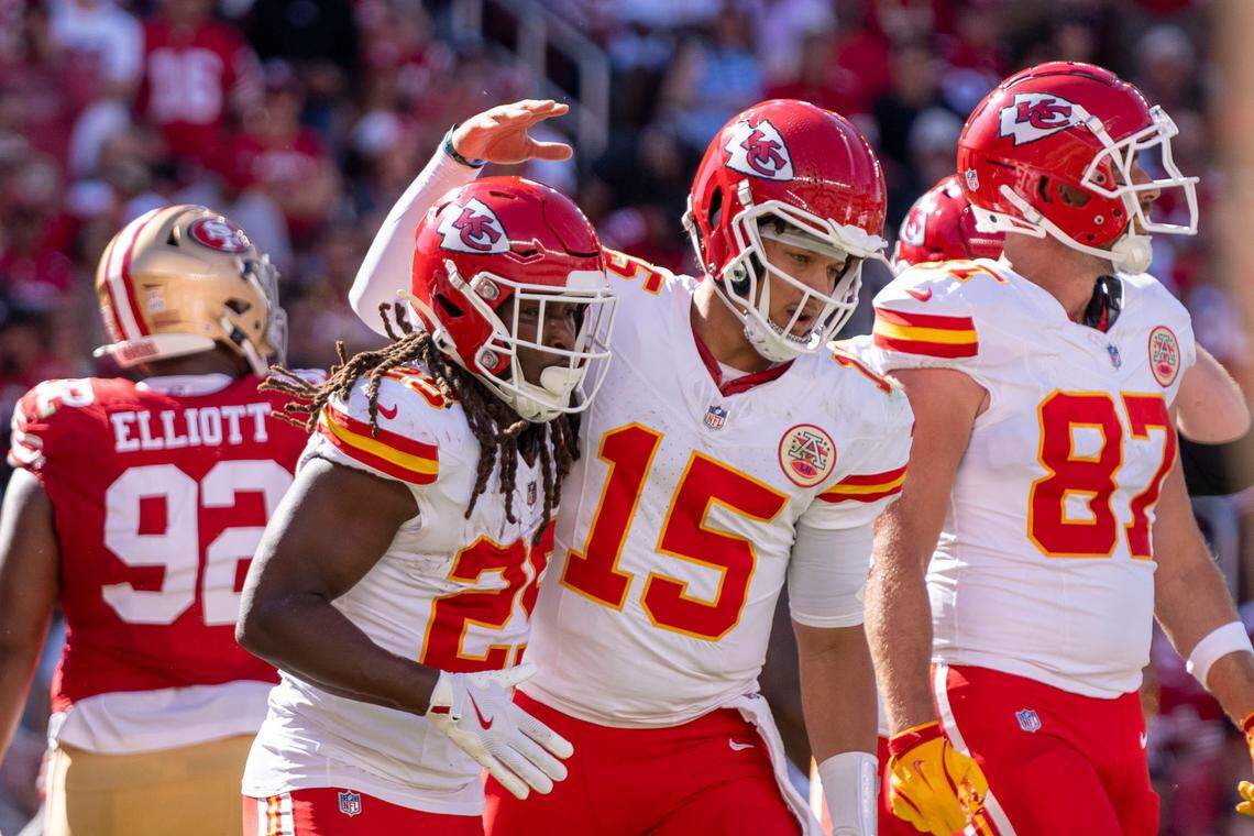 Kansas City Chiefs running back Kareem Hunt (29) is congratulated by quarterback Patrick Mahomes (15) after scoring a touchdown against the San Francisco 49ers during the second quarter at Levi’s Stadium.
