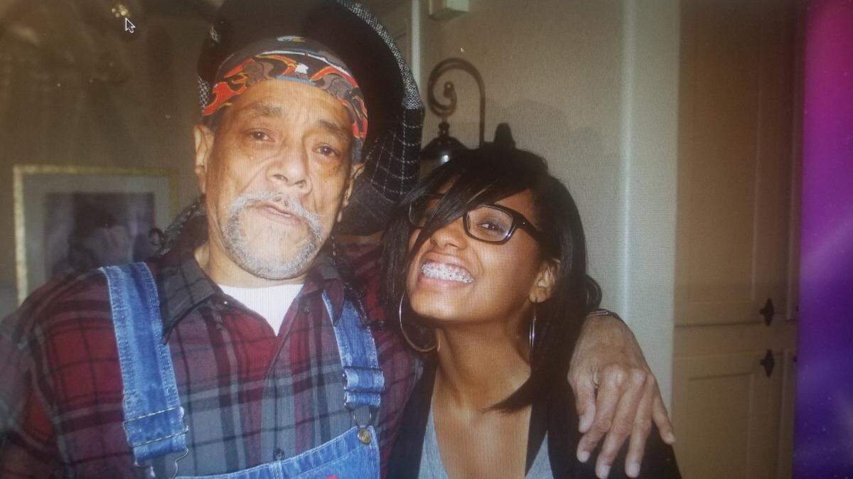 Paul Carroll (left) poses with his great-niece, Milan Law, at a family party within the past year. Carroll had a reputation as the fun uncle in his family.