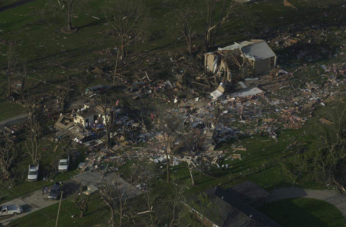 This Kansas City, Kan. house and outbuilding were in the path of one of tornados on May 4, 2003. It is east of Wyandotte County Park near Leavenworth Road.