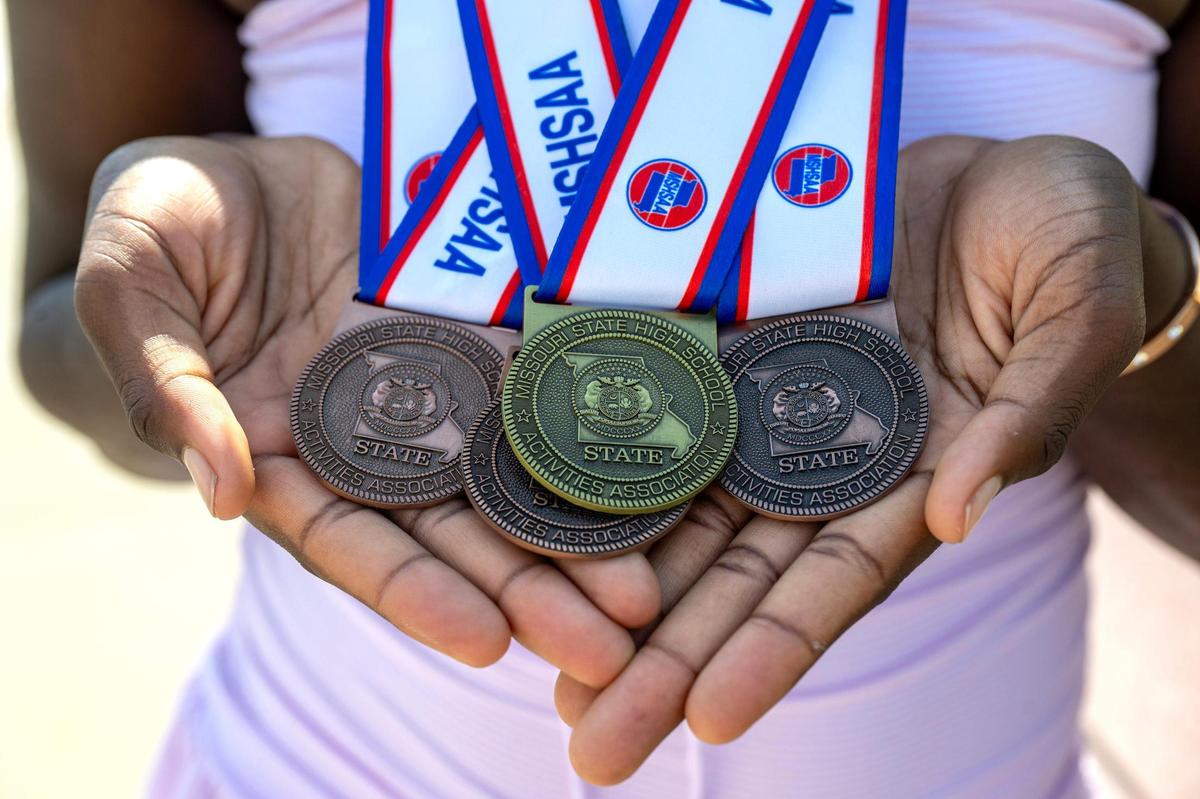 Louise Juitt of Belton High School, displays some of the medals she won during wrestling meets for The Missouri State High School Activities Association.