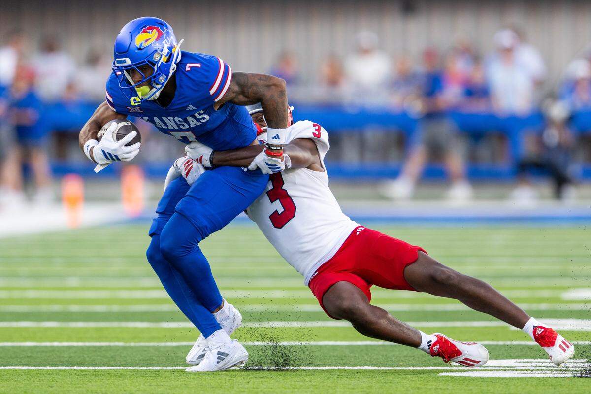 Kansas Jayhawks wide receiver Cam Pickett (7) gets tackled by Fresno State Bulldogs defensive back Al'zillion Hamilton (3) in the first half of the Jayhawks game vs. the Fresno State Bulldogs on Saturday, Aug. 23, 2025, at David Booth Kansas Memorial Stadium, in Lawrence.