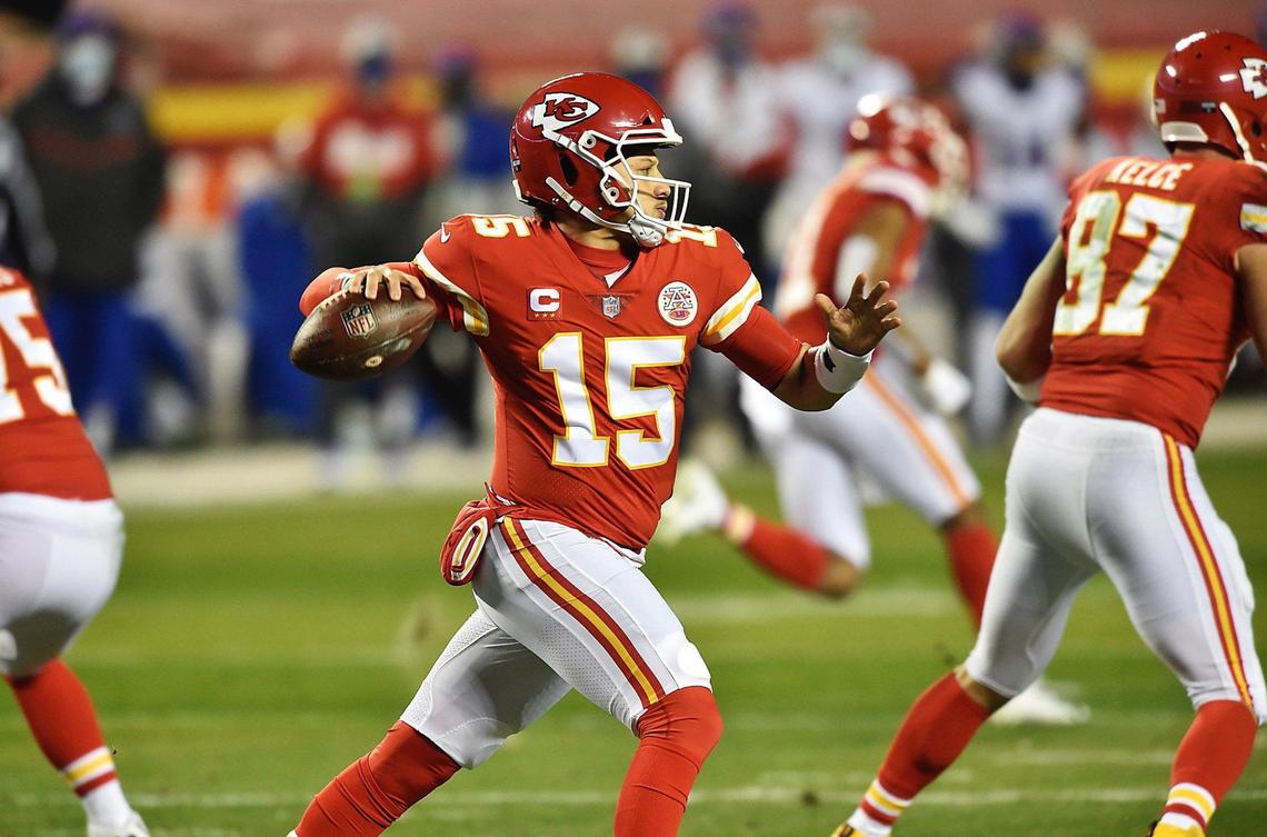 Kansas City Chiefs quarterback Patrick Mahomes looks for an open receiver in the first half Sunday, January 24, 2021, during the AFC Championship Game at Arrowhead Stadium in Kansas City, Missouri.