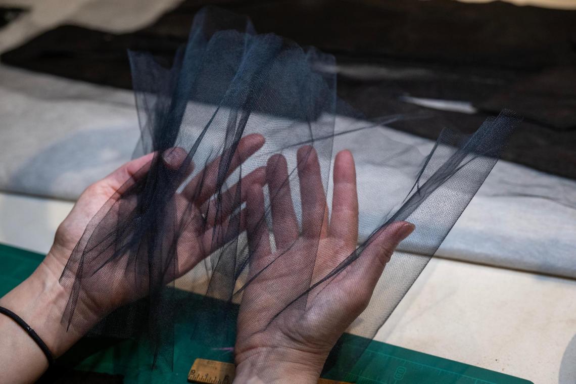 Textiles conservator Holly Messinger displays a nylon mesh she will use in the preservation of a man’s frock coat (1853-1856) at the Arabia Steamboat Museum in Kansas City on Thursday, April 18, 2025. The nylon mesh will give the wool fabric some stability.