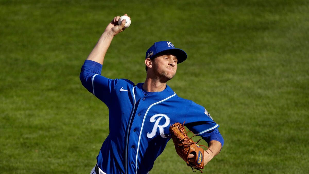 Kansas City Royals pitcher Jackson Kowar throws during the seventh inning of a spring training baseball game against the Cleveland Indians Sunday, Feb. 22, 2020, in Surprise, Ariz. (AP Photo/Charlie Riedel)