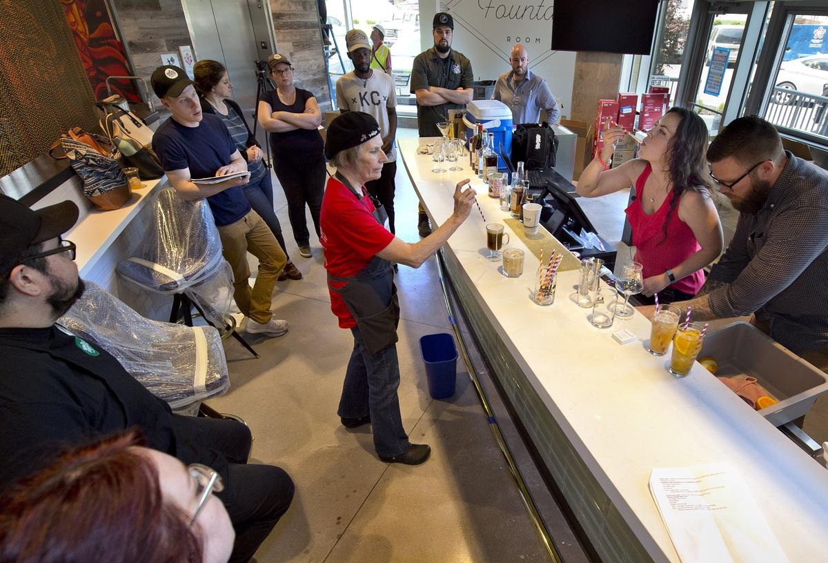 The Whole Foods Market near the UMKC campus will open on Wednesday, May 23, 2018, at 301 E. 51st St. The Fountain Room that occupies one corner of the store will be a combination coffee bar and taproom. Erica Schulte (second from right) of J. Rieger & Co. distillery taught employees how to mix drinks using the company's spirits.