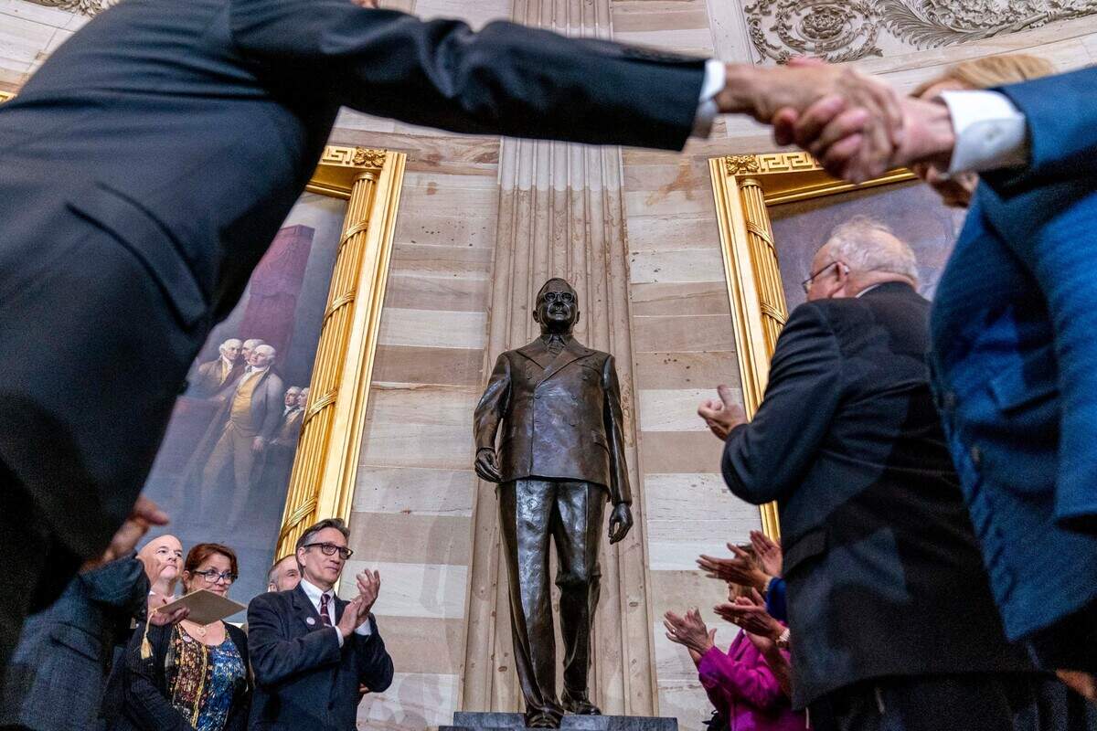 Former President Harry S. Truman’s eldest grandson Clifton Truman Daniel, center left, accompanied by Congressional leadership and members of the Missouri Congressional Delegation, applaud after unveiling the Congressional statue of the former president during a ceremony in the Rotunda of the U.S. Capitol Building in Washington, Thursday, Sept. 29, 2022. (AP Photo/Andrew Harnik)