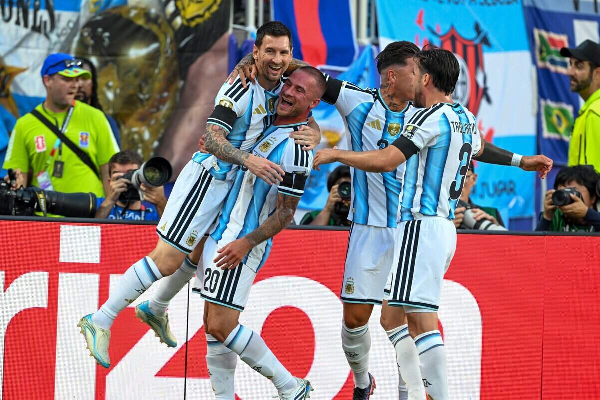 Argentina forward Lionel Messi (10) celebrates with Argentina midfielder Alexis Mac Allister (20) after Mac Allister scores the first goal of the Argentina vs. Switzerland 2026 World Cup Quarterfinal football match at Kansas City (Arrowhead) Stadium in Kansas City on Saturday, July 11, 2026.