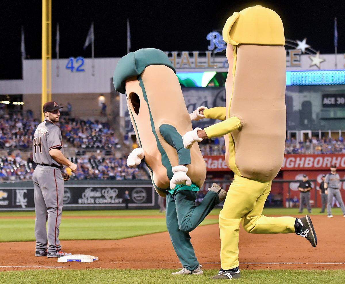 Arizona Diamondbacks first baseman Paul Goldschmidt watches as Relish is pushed over by Mustard in the Hot Dog Derby during a 2017 Kansas City Royals baseball game at Kauffman Stadium.