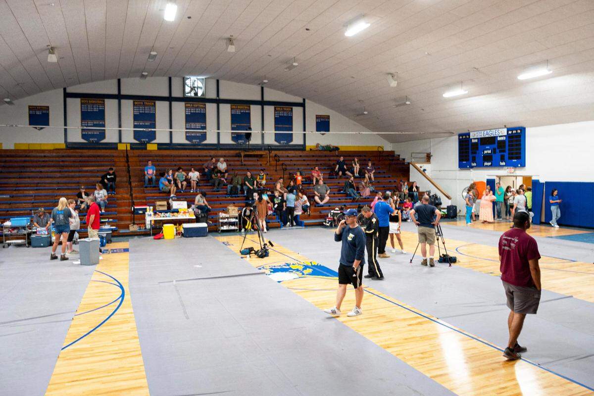 Passengers of an Amtrak train that crashed into a truck near Mendon, Missouri, Monday gather in the gymnasium at Northwestern R-1 School.