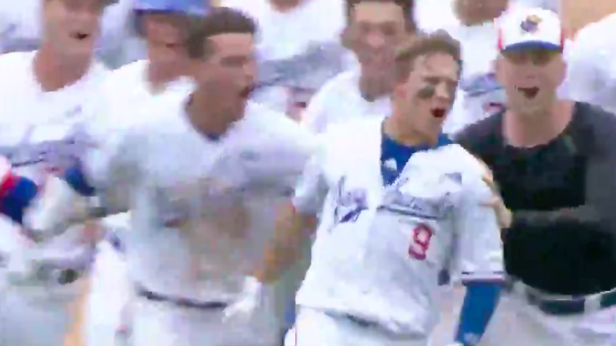 Kansas’ James Cosentino celebrates an 11th-inning, walkoff single in KU’s 15-14 victory over Kansas State on Thursday in the Big 12 Tournament in Oklahoma City.