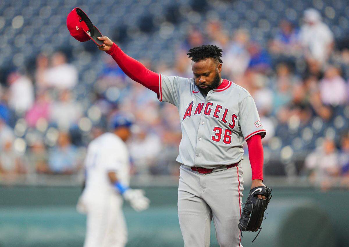 Los Angeles Angels pitcher Johnny Cueto doffs his cap after retiring Kansas City Royals catcher (and former KC teammate) Salvador Perez during the first inning of Wednesday evening’s game at Kauffman Stadium.