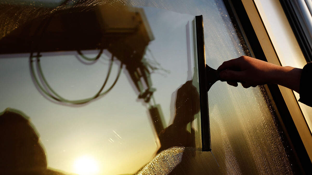 Cleaning window. (Photo by Matthew Lloyd/Getty Images)