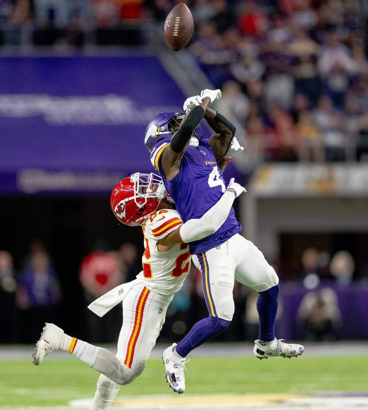 Kansas City Chiefs cornerback Trent McDuffie (22) breaks up a pass intended for Minnesota Vikings wide receiver Brandon Powell (4) during an NFL football game on Sunday, Oct. 8, 2023, at U.S. Bank Stadium in Minneapolis, Minn.