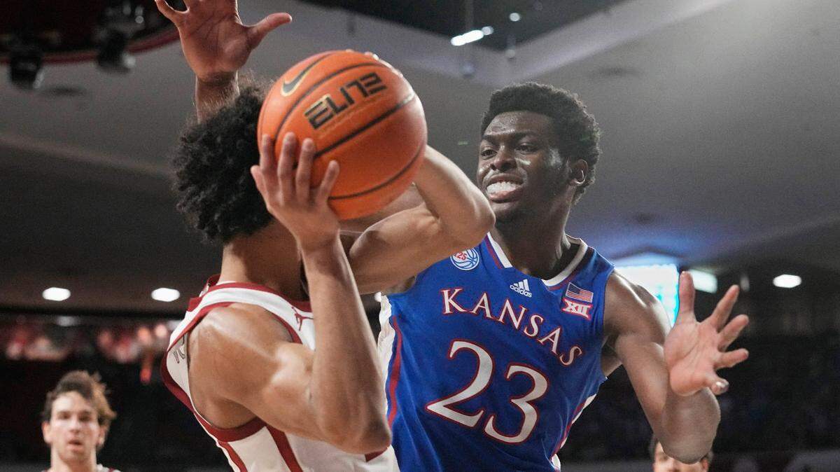 Kansas center Ernest Udeh Jr. pressures Oklahoma guard Milos Uzan in the second half of a Big 12 game Saturday, Feb. 11, 2023, in Norman, Okla.