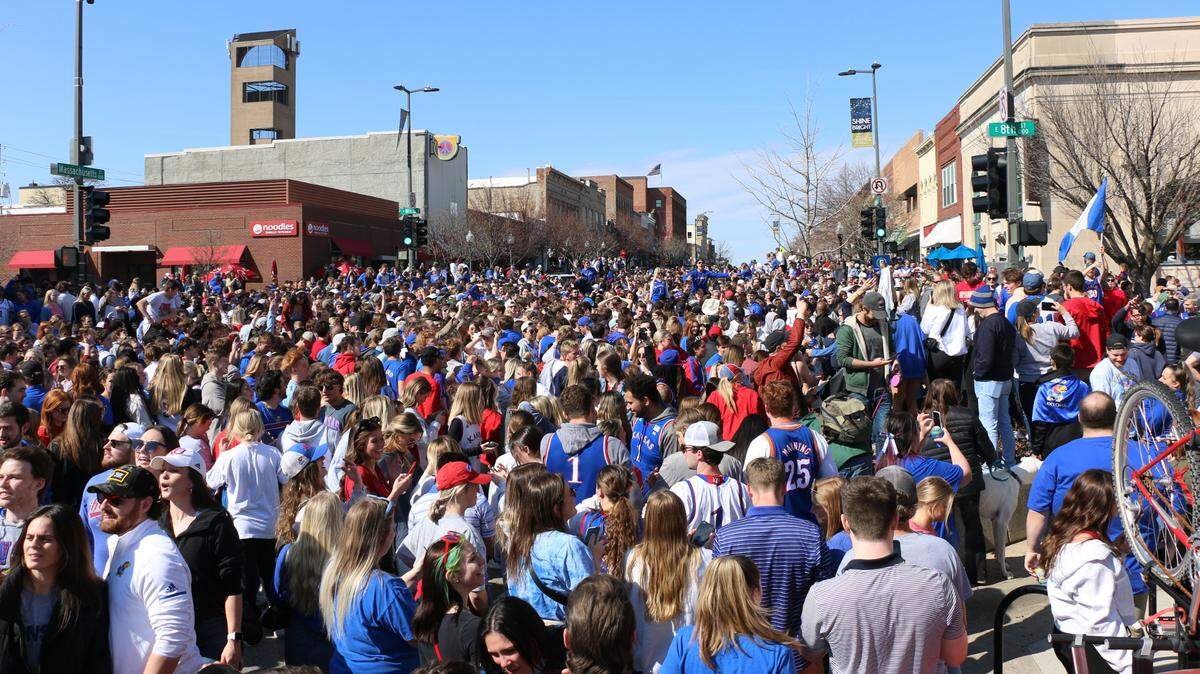 University of Kansas students and Jayhawk fans packed Massachusetts Street in downtown Lawrence Sunday to celebrate after the KU men’s basketball team earned a spot in the Final Four by defeating the University of Miami.