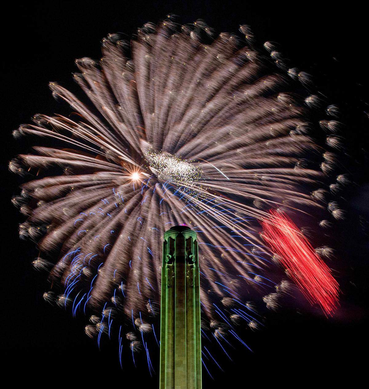 Fireworks light the sky over the National WWI Museum and Memorial during the Celebration at the Station Memorial Day event Sunday, May 25, 2025, in Kansas City.