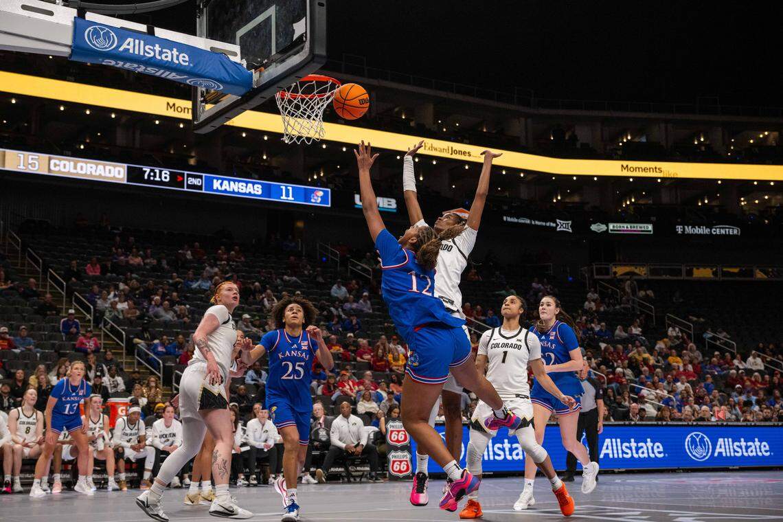Kansas Jayhawks guard S'Mya Nichols (12) shoots a running layup in the first half of KU’s second-round game at the Big 12 Women's Basketball Tournament on Thursday, March 5, 2026, at T-Mobile Center in Kansas City.