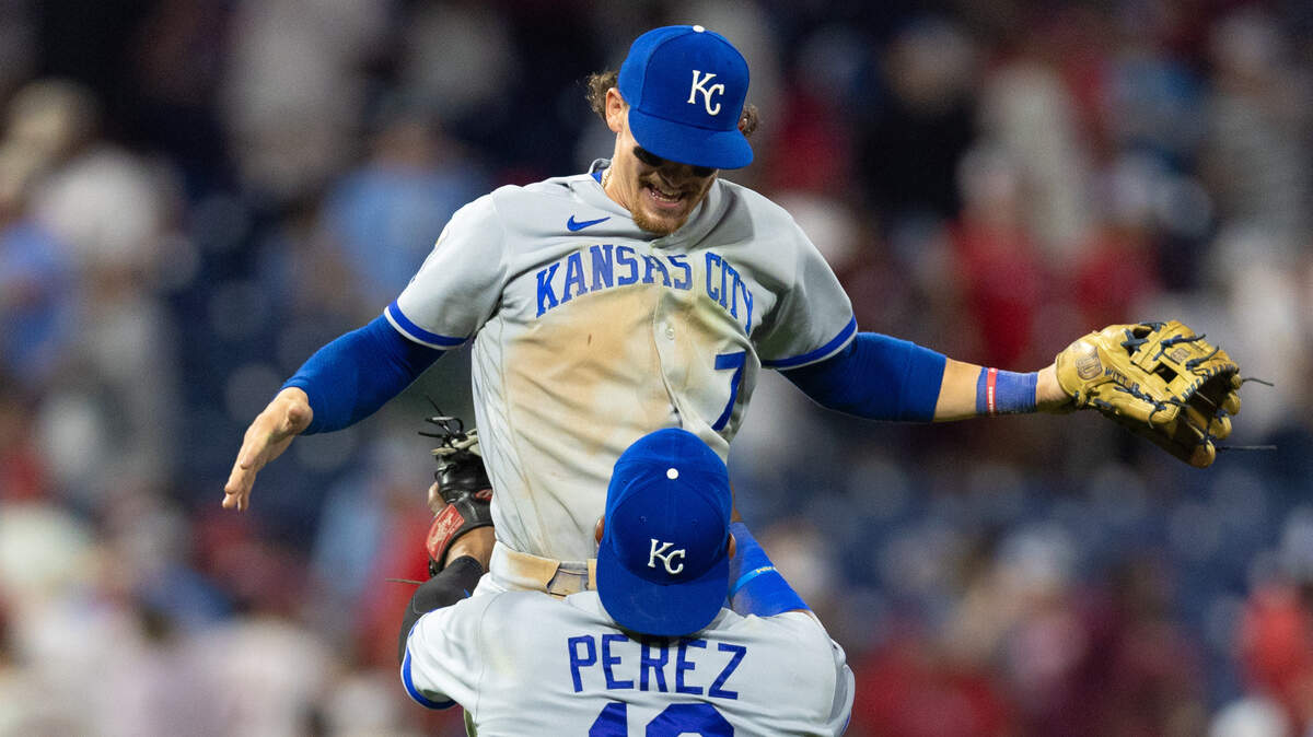 Kansas City Royals catcher Salvador Perez (13) lifts shortstop Bobby Witt Jr. (7) as they celebrate a victory against the Philadelphia Phillies at Citizens Bank Park on Aug. 4, 2023.
