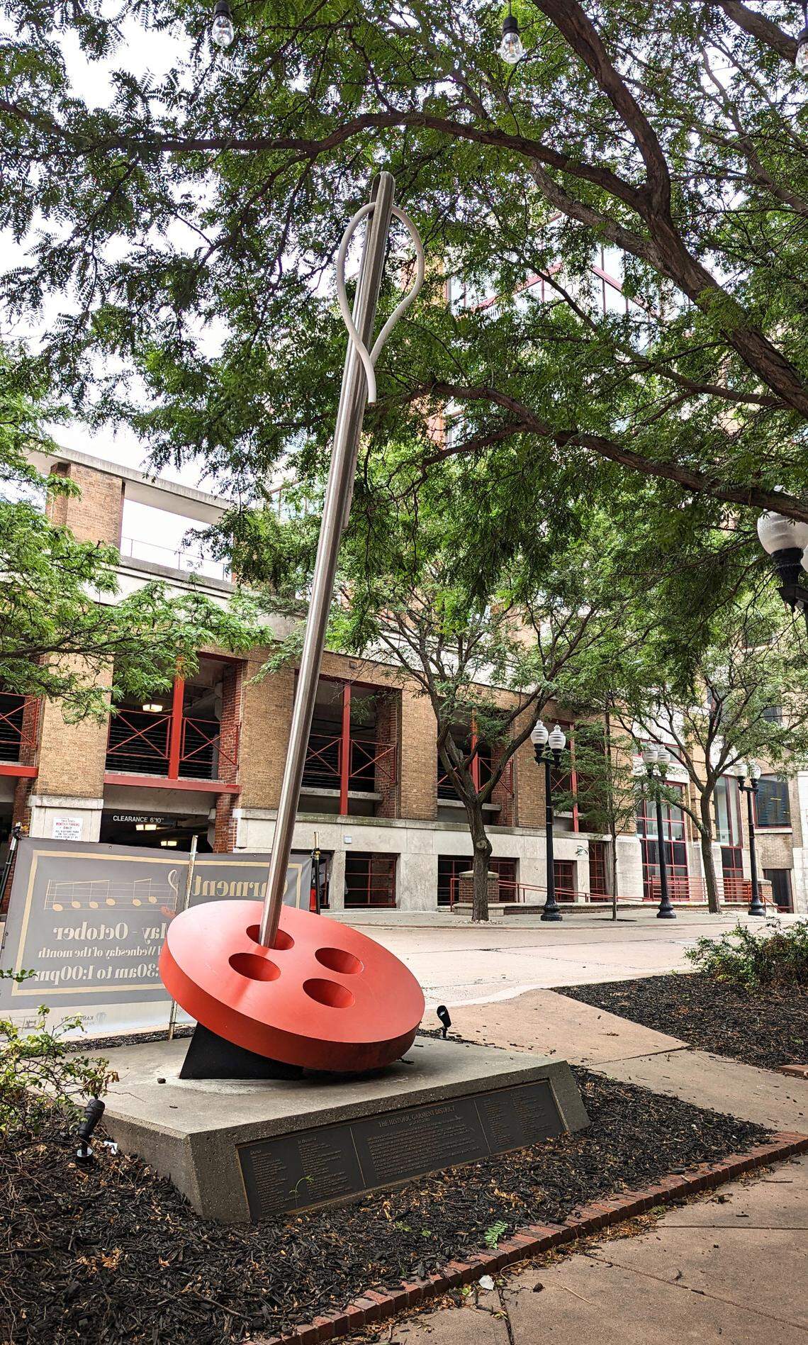 The Needle and Button Sculpture memorializes the former Kansas City Garment Industry and its workers.