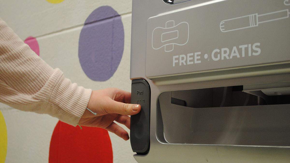Students just need to push a button to get a free pad or tampon.