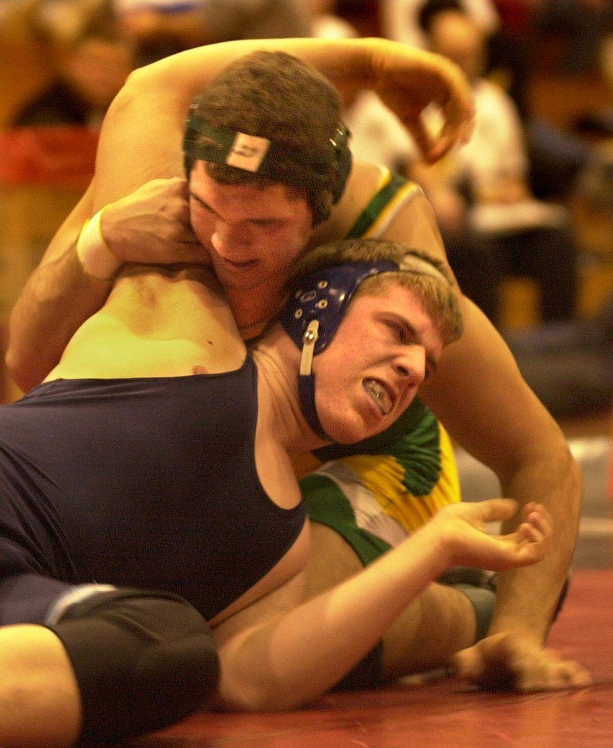 K-State defensive coordinator Blake Seiler was a multisport athlete at Bishop Carroll, where he beat East's Adam Knipp (bottom) during a 215-pound wrestling match in 2002.