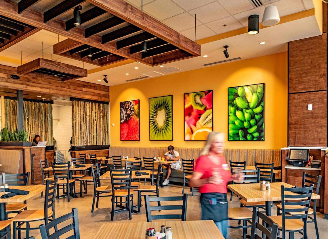 Food photographs adorn the walls inside Urban Egg, where floor to ceiling front windows let in plenty of light.