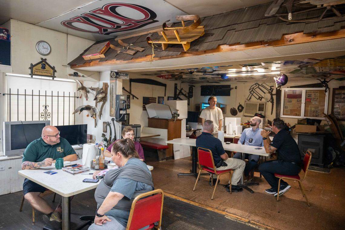 Customers wait on their food orders inside Peter May's House of Kielbasa, on Tuesday, Oct. 7, 2025. The hole-in-a-wall restaurant has been around since the 1940s and used to be a neighborhood grocery store.