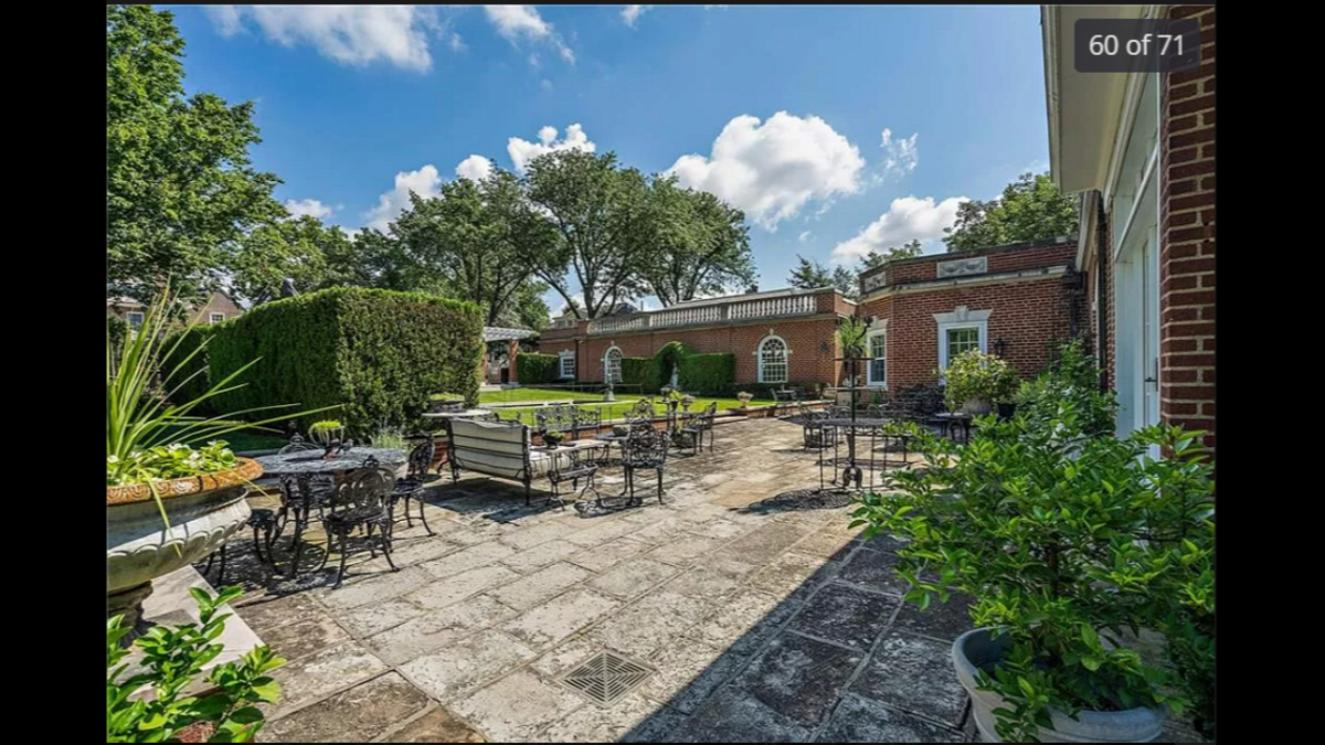 Part of the backyard at 1228 W. 56th St. The fenced-in property was built in 1922.