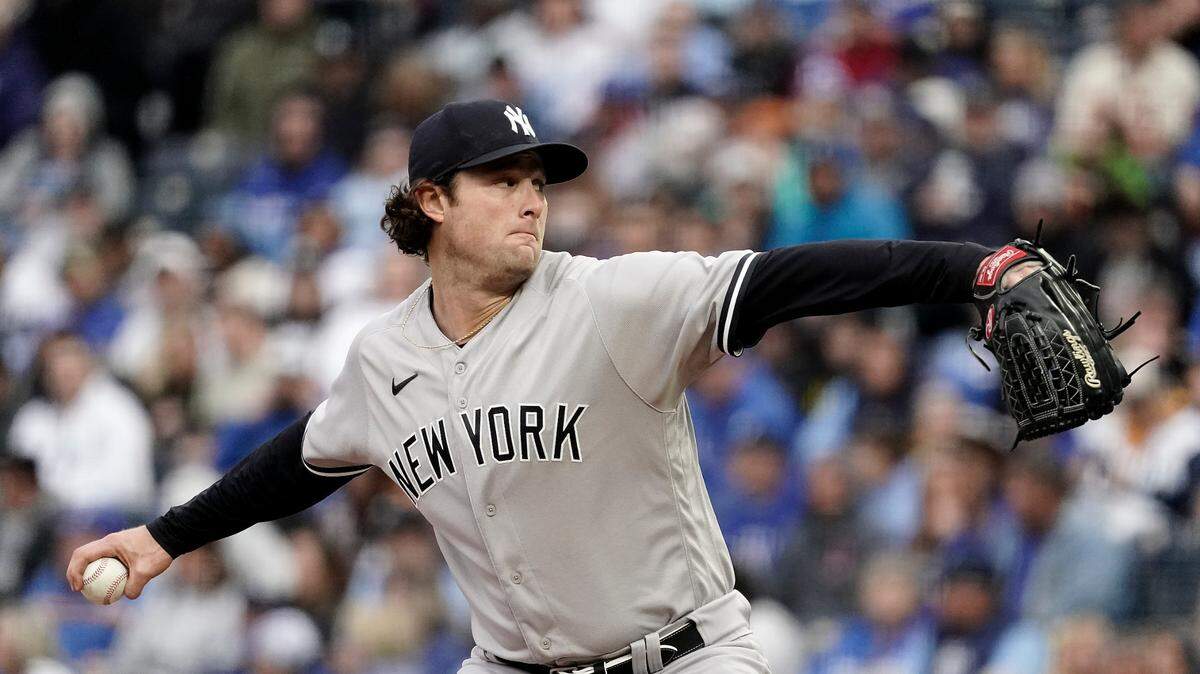 New York Yankees starting pitcher Gerrit Cole throws during the first inning of a baseball game against the Kansas City Royals Saturday, April 30, 2022, in Kansas City, Mo. (AP Photo/Charlie Riedel)