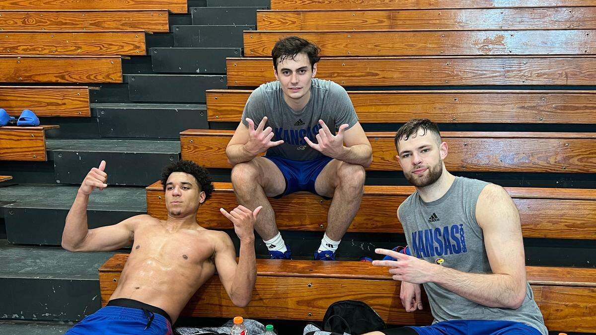 Parker Braun, middle, catches his breath after practice Wednesday, Aug. 2, 2023, in Puerto Rico with Kevin McCullar, left, and Hunter Dickinson, right.
