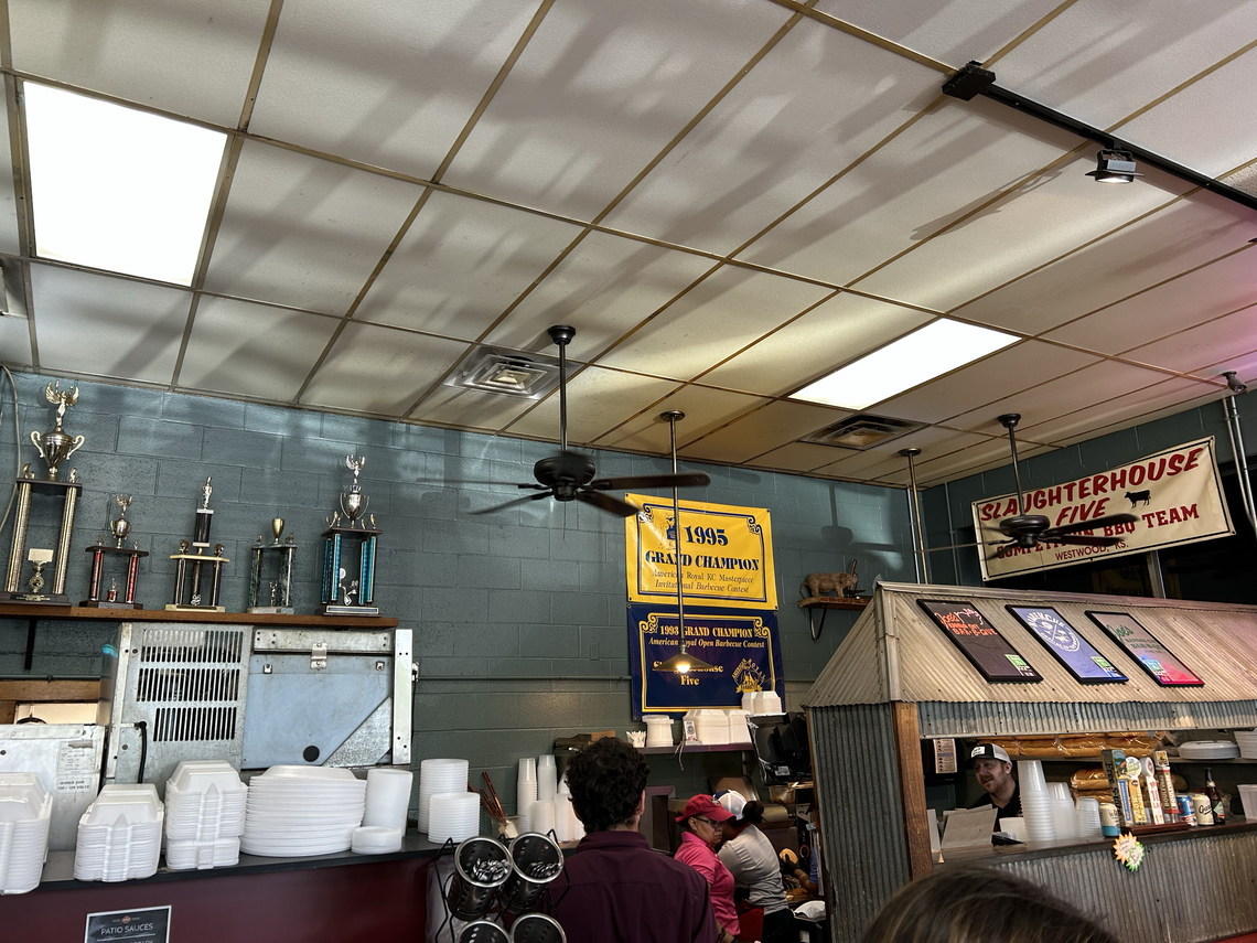 Joe’s interior pays homage to the Stehneys’ beginnings, including a “Slaughterhouse Five” banner and trophies from the couple’s barbecue competitions.