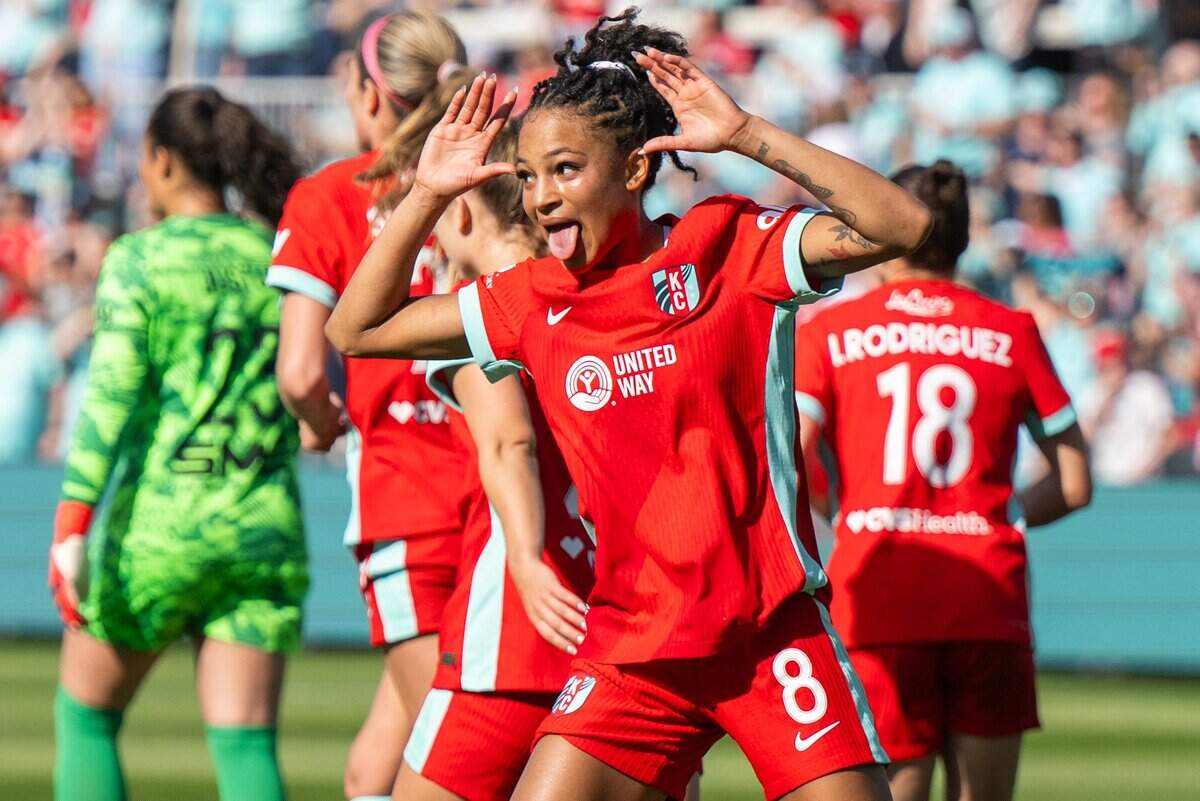 Kansas City Current players celebrate after a goal by Kansas City Current midfielder Croix Bethune (8) in the second half of the Current's match vs. the Utah Royals, on Saturday, March 14, 2026, at the CPKC Stadium. The Current won 2-1 against the Utah Royals.