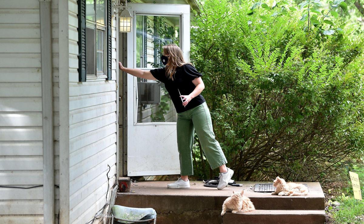 Annaliese Schroeder, a community health advocate, canvassed a north Springfield neighborhood Thursday, July 15, 2021, for the Springfield-Greene County Health Department in the hopes of boosting COVID-19 vaccinations. As Missouri hits a wall in vaccinations, prompting a rapid spread of the deadlier COVID variant, health officials have turned to a painstaking and personalized outreach effort including door-to-door engagement and partnerships with trusted community leaders.