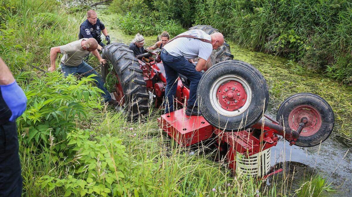 A man pinned under a tractor for hours was rescued, Illinois firefighters said.